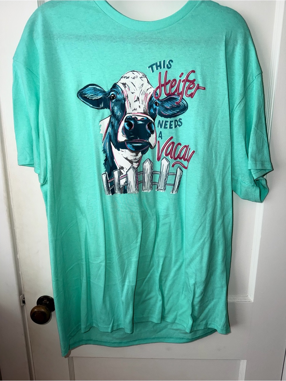 Aqua Graphic Tee with Cow "This Heifer Needs a Vacay"